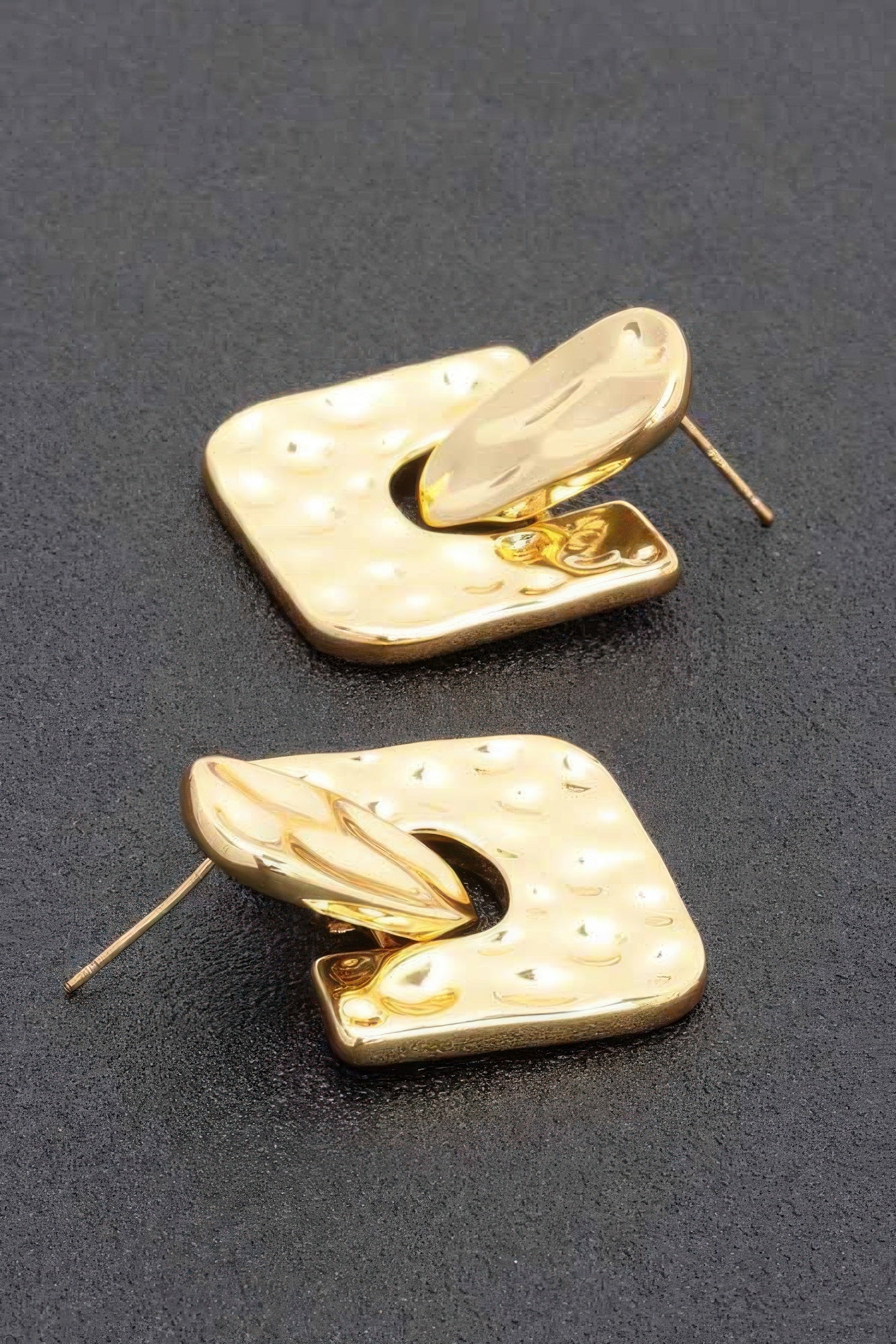 Gold dip earrings with textured U-shaped plates, open center, and straight post
