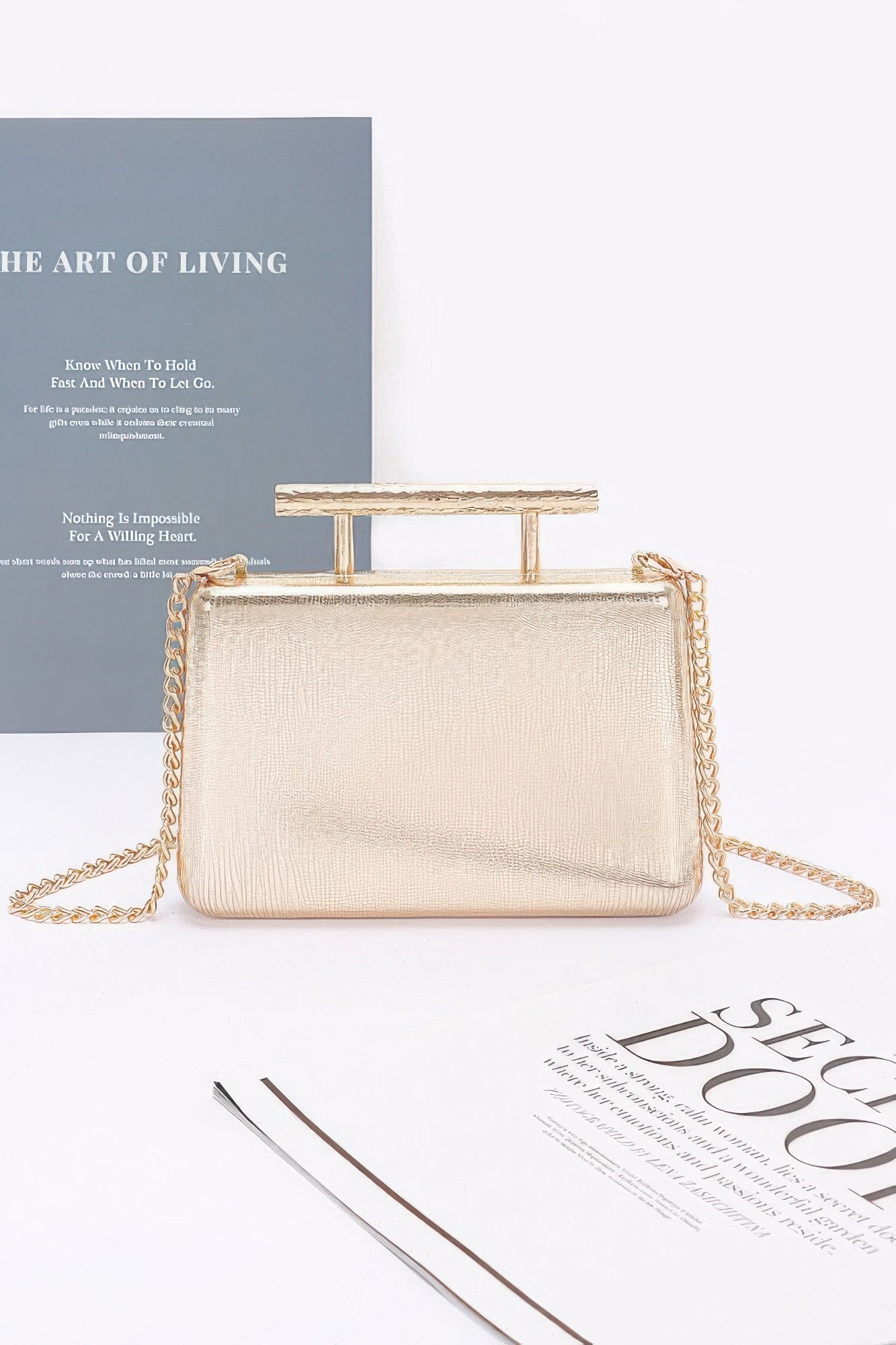 Metal handle top case clutch with faux gold mesh texture and chain strap