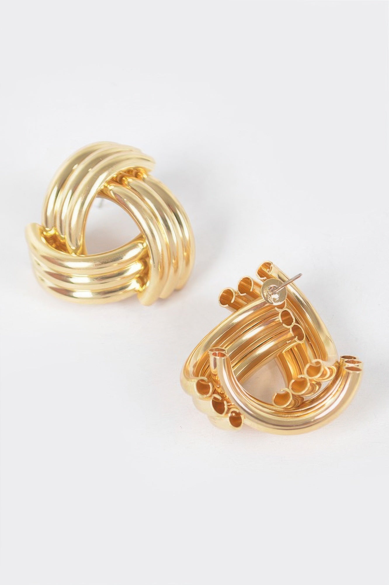 Gold metal stud hoop earrings with multi-ring design and small button-like studs