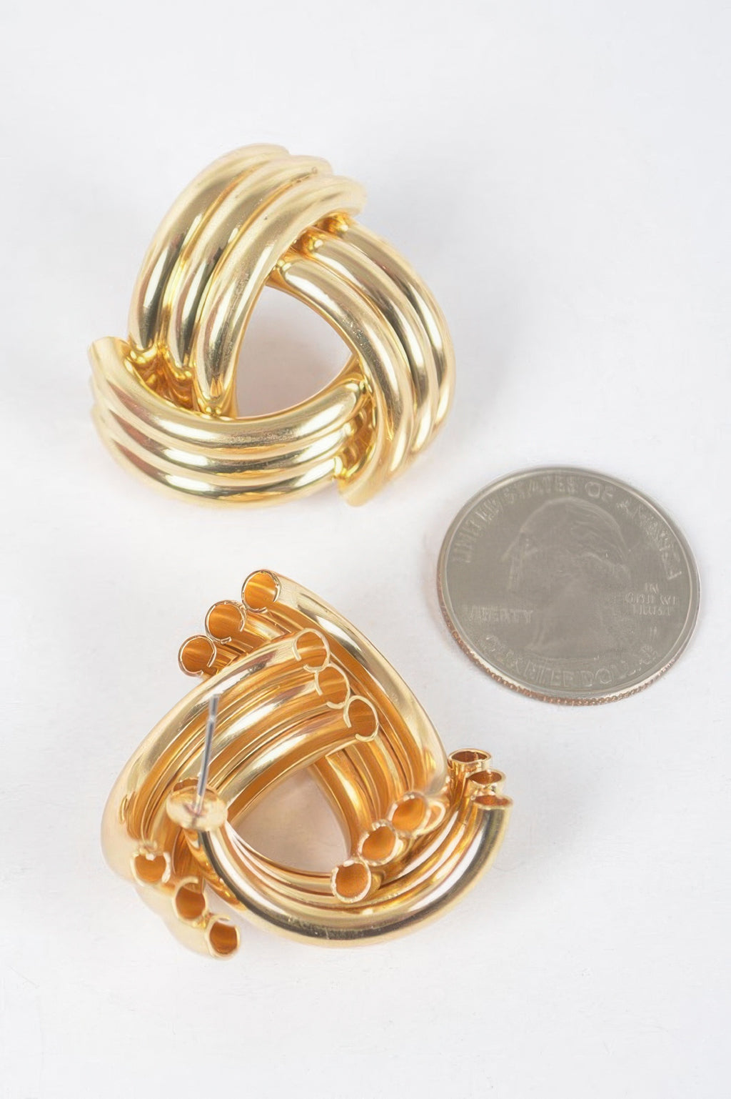 Gold metal stud hoop earrings—stacked rings with front row of tiny stud details
