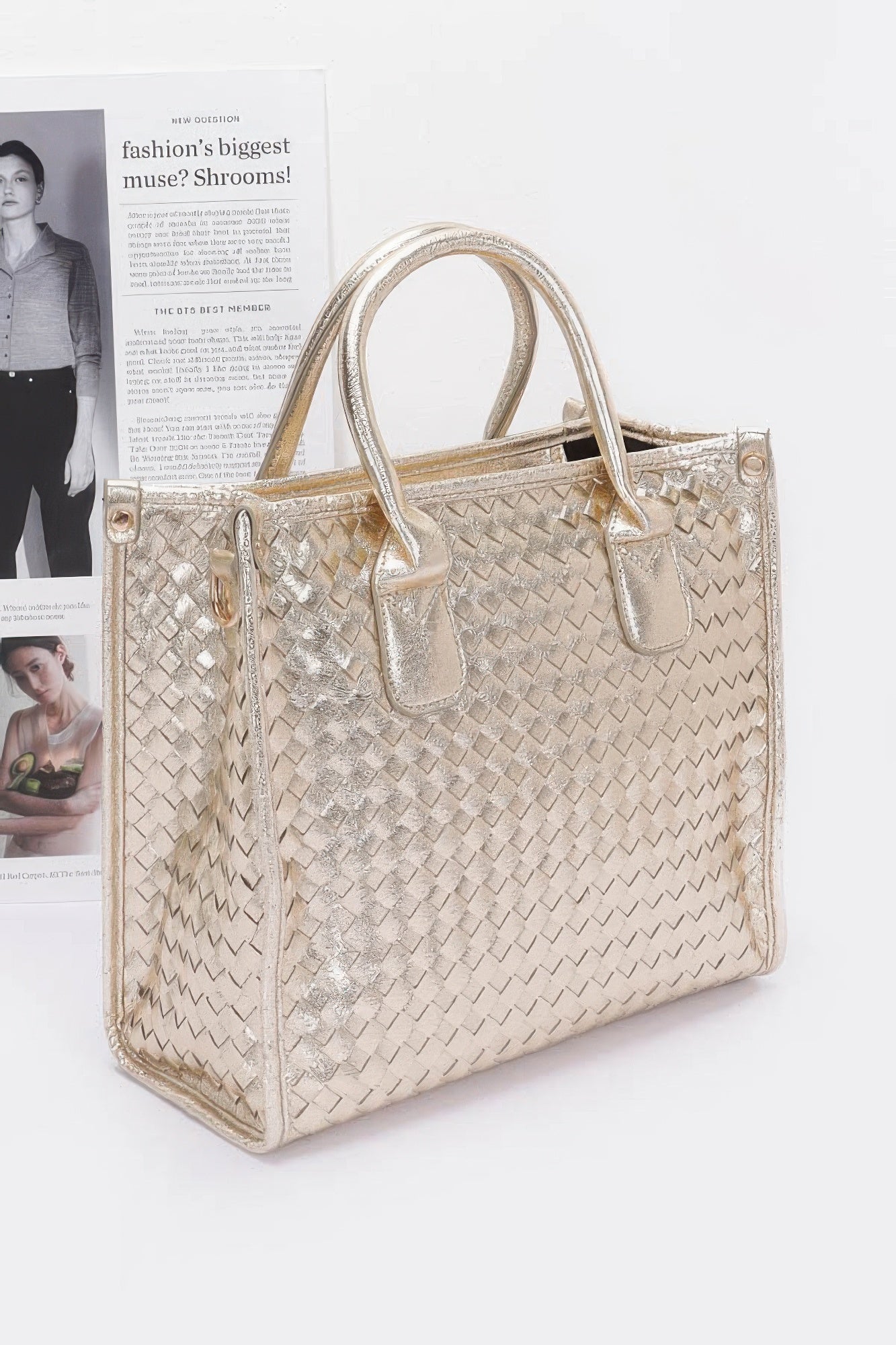 Metallic braided tote bag in gold with adjustable shoulder strap and top handles