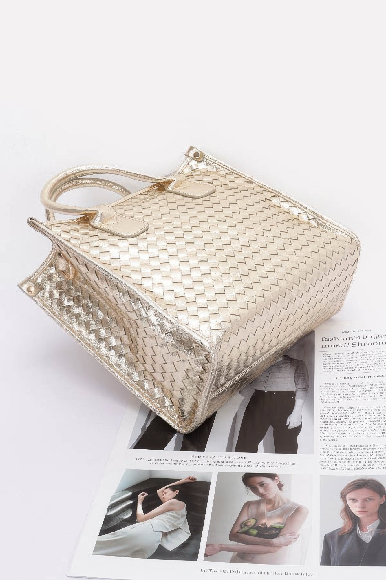 Metallic braided tote bag in gold tone, side view with short handles