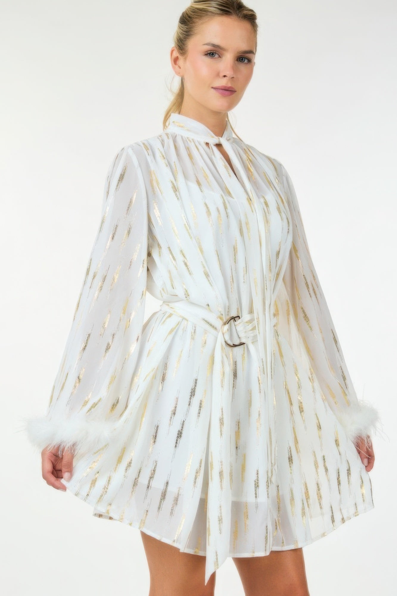 White metallic print short dress with long sleeves and faux-fur cuff trim, tied waist