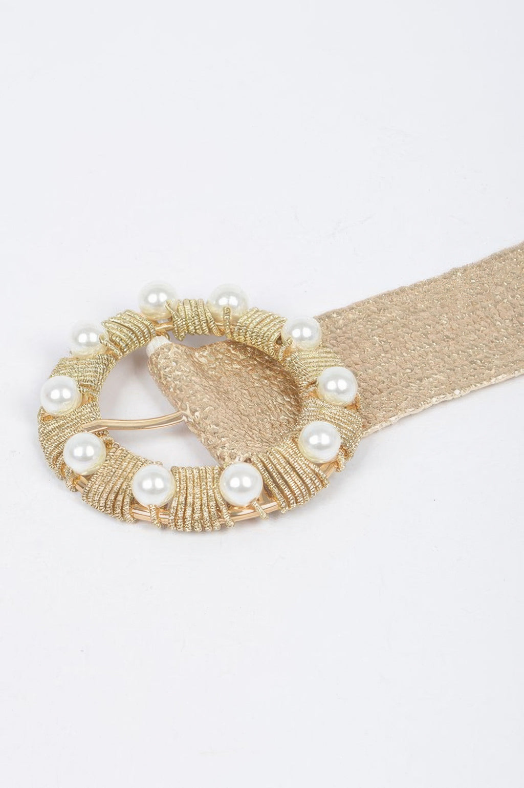 Gold tone beaded round buckle with white pearls on metallic stretch band