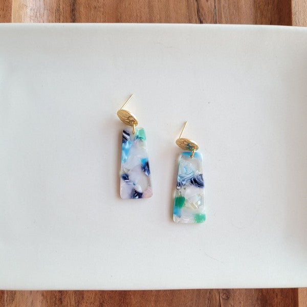 Mini rectangular resin earrings with gold tops; blue, white, and green confetti colors