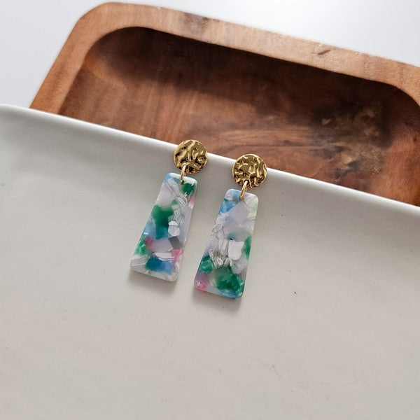 Mini earrings on tray: gold filigree studs with blue-green-pink resin rectangle drops