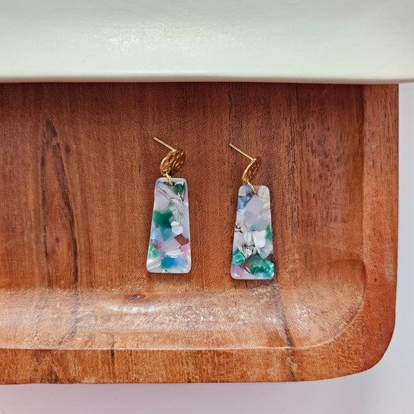 Gold-tone hoop dangles with blue-green swirled acrylic rectangle pieces