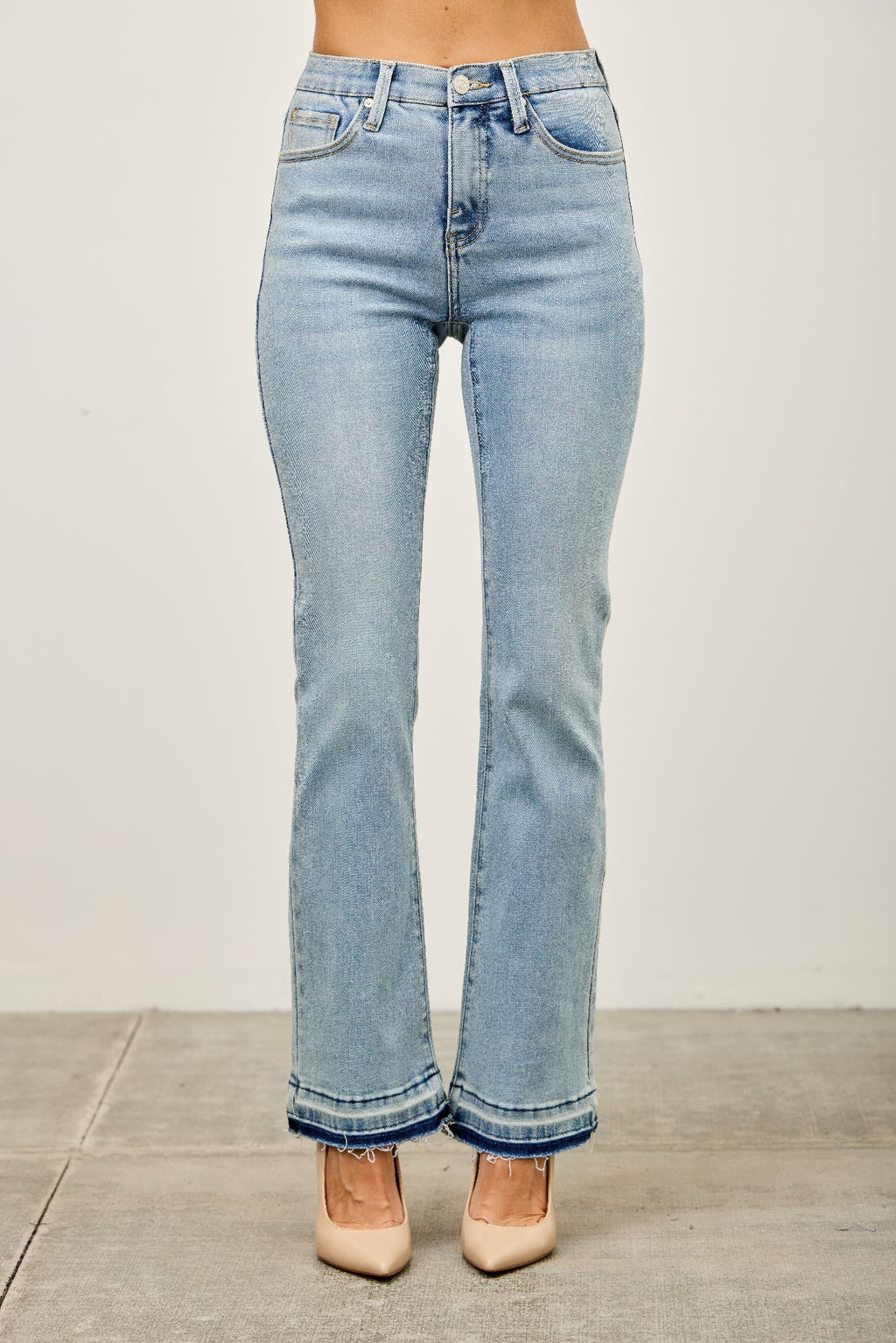 Mid-rise flare jeans with released hem detail at cuffs, light blue denim