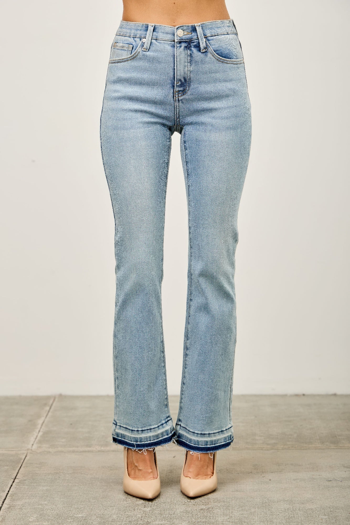 Mid-rise flare jeans with released hem detail at cuffs, light blue denim