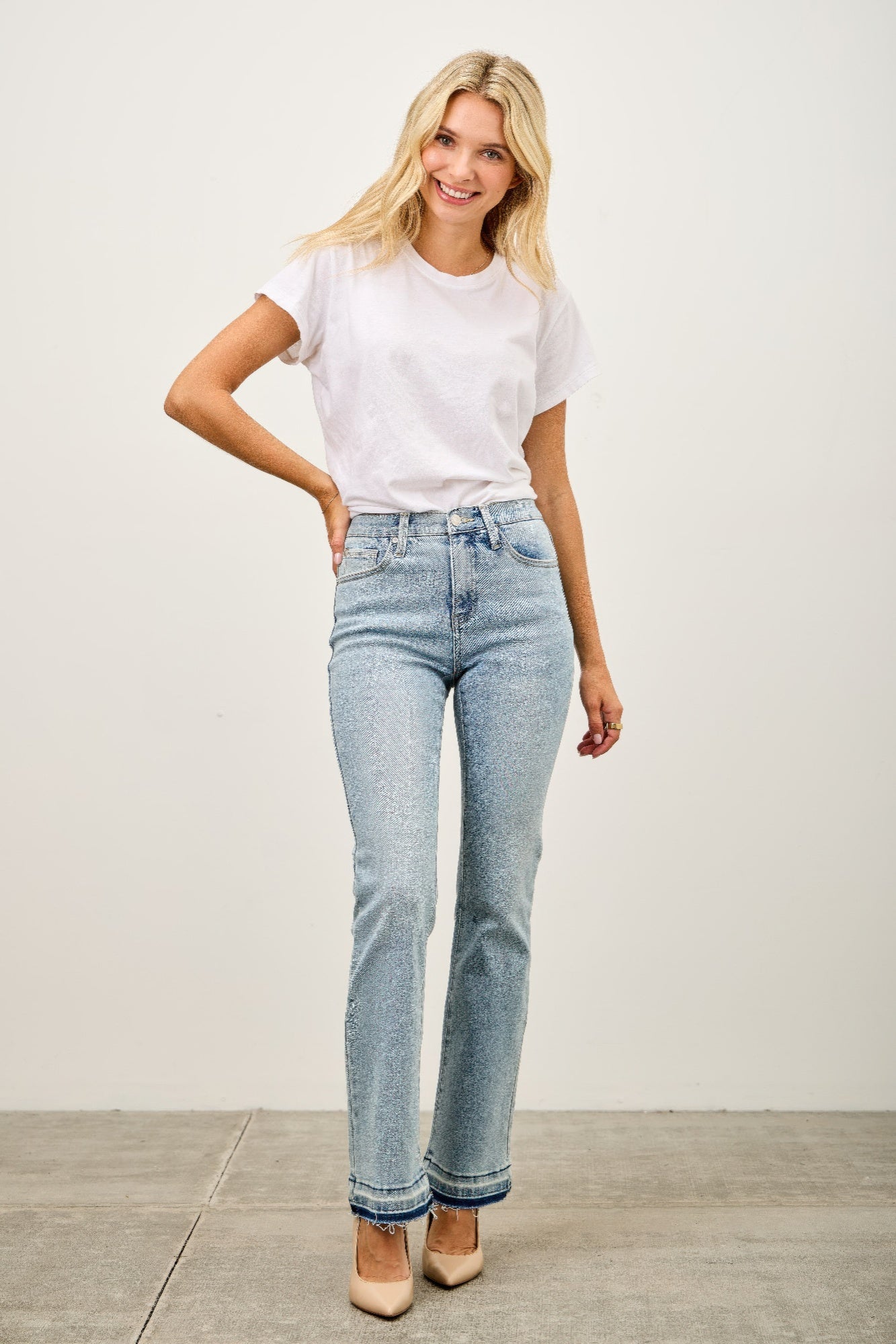 Mid-rise flare jeans, light blue wash, relaxed fit through thighs, released hem