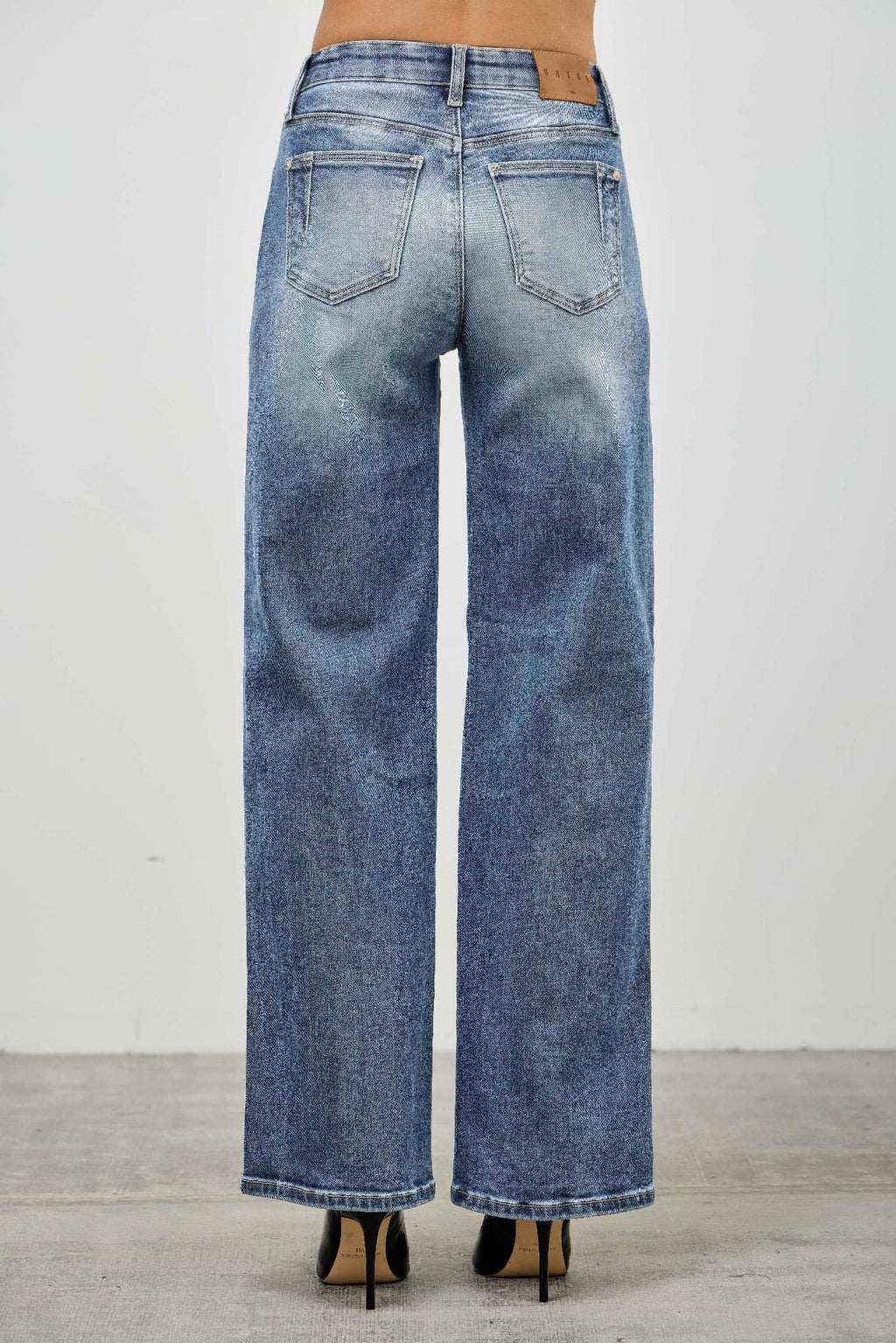 Blue mid-rise straight jeans back view with two patch pockets and waistband