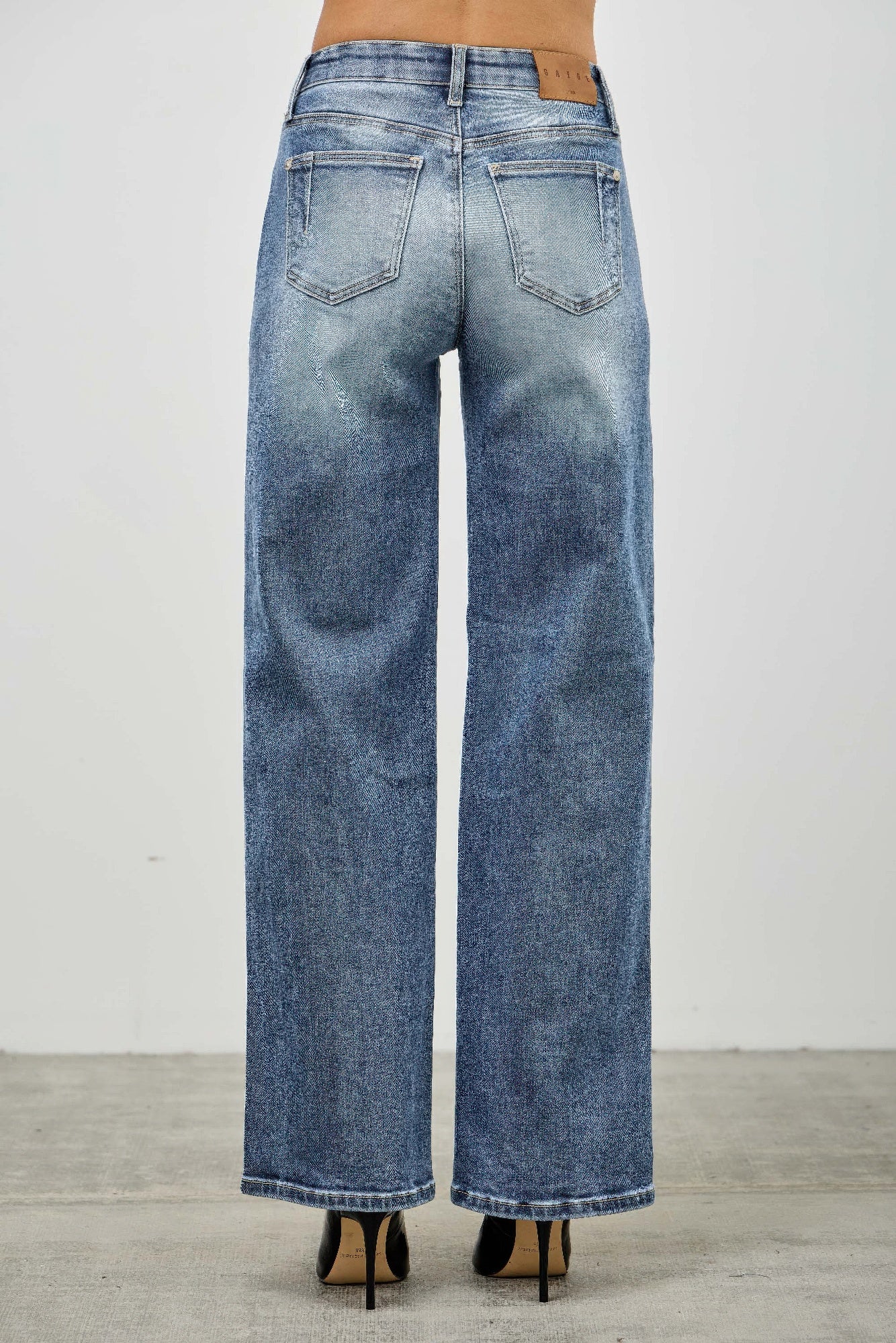 Blue mid-rise straight jeans back view with two patch pockets and waistband