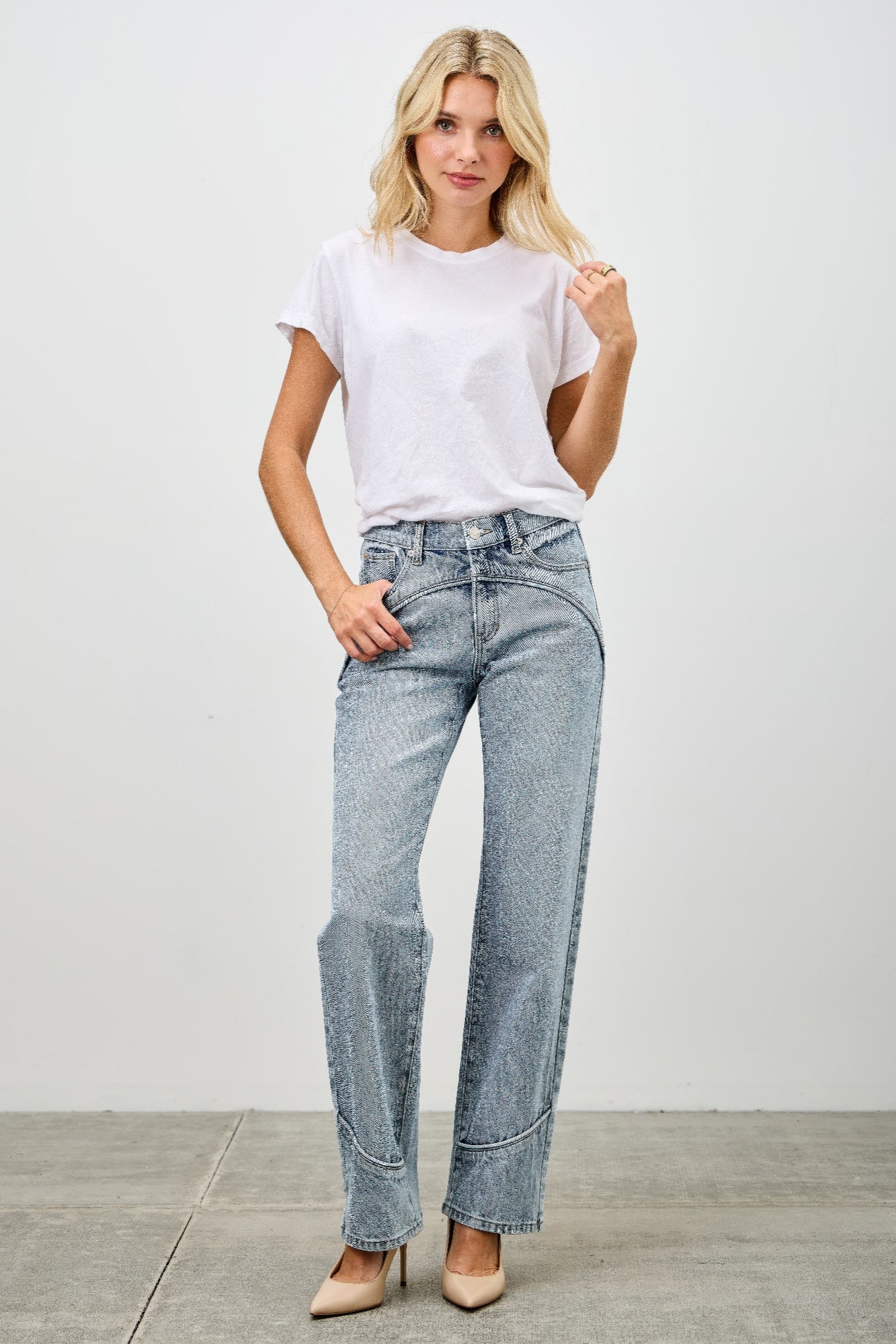 Mid-rise straight jeans with contrast piping, light-wash blue denim, side view