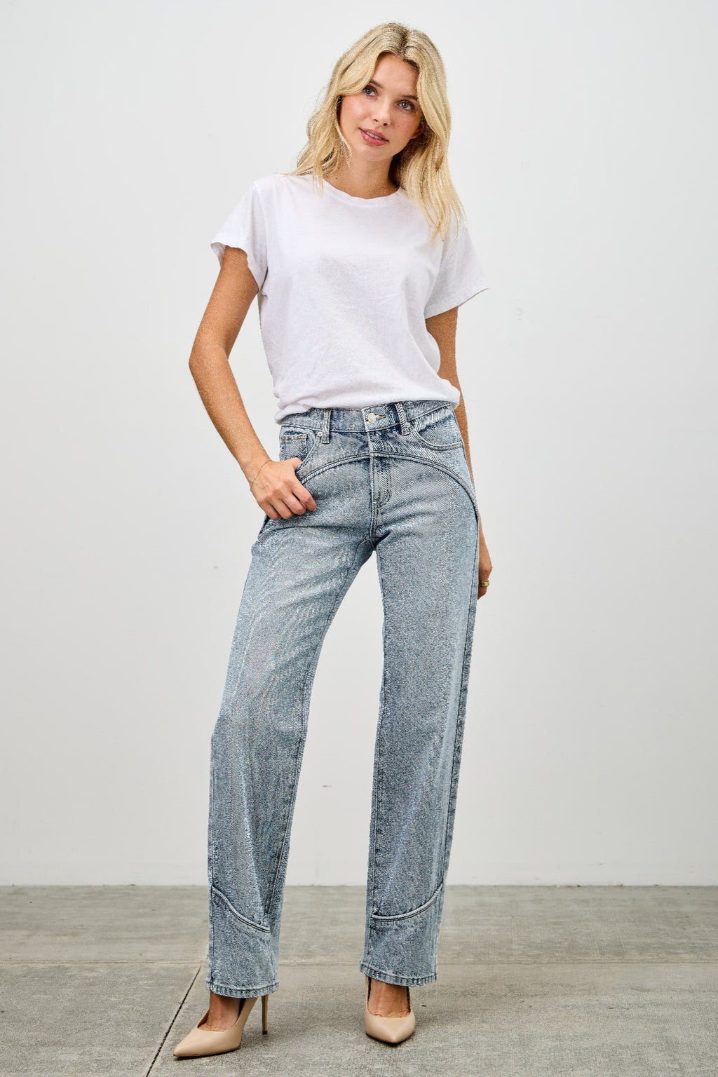Mid-rise straight jeans with contrast piping, light-wash blue denim, front/hip view