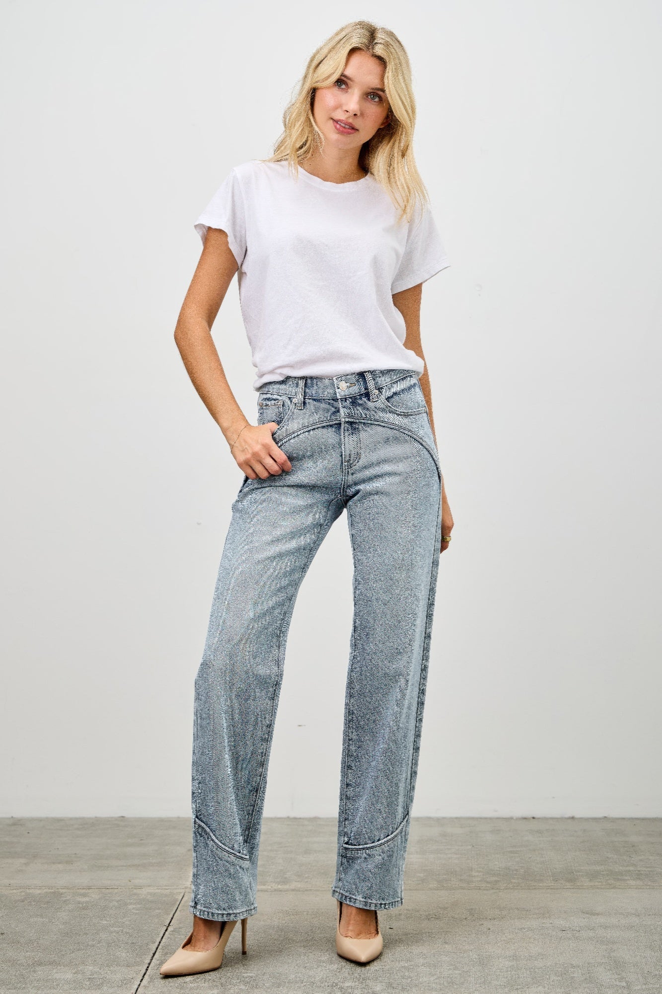 Mid-rise straight jeans with contrast piping, light-wash blue denim, front/hip view