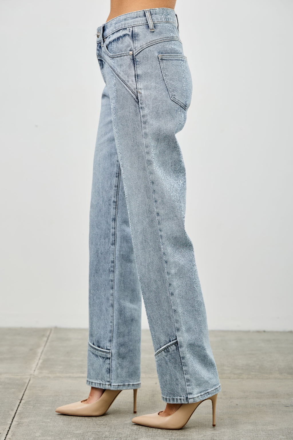 Mid-rise straight jeans with contrast piping, light-wash blue denim, back/side view