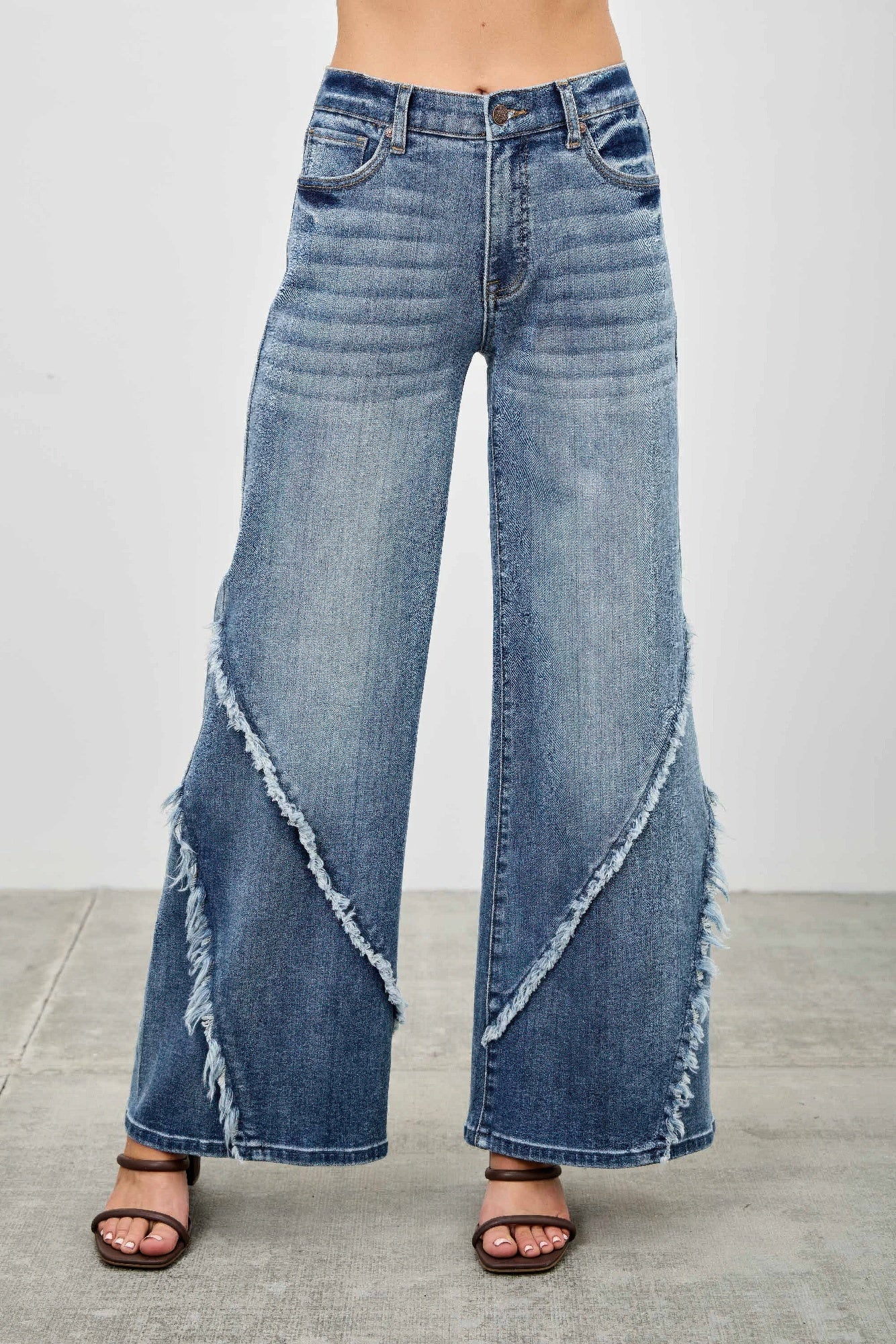 Mid-rise wide-leg jeans in light wash with diagonal frayed seam detail