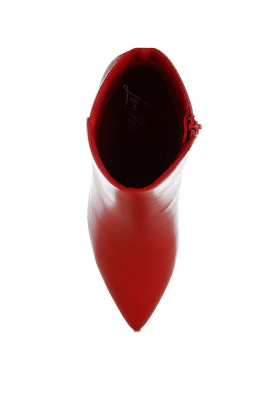 Red faux leather boot showing inner lining and pointed toe opening