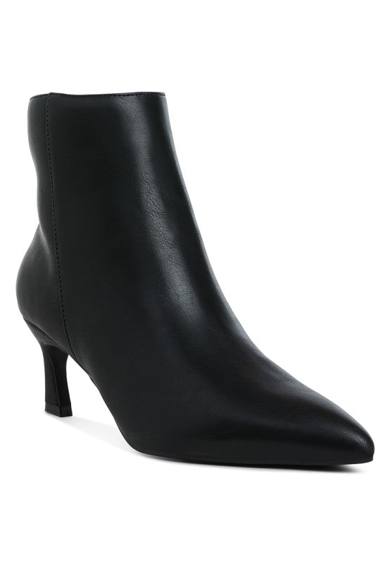Black faux leather ankle boots with block heel and sleek pointed toe