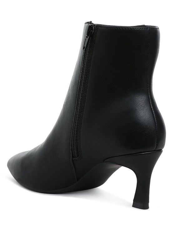 Black ankle boots with side zipper and tapered heel profile