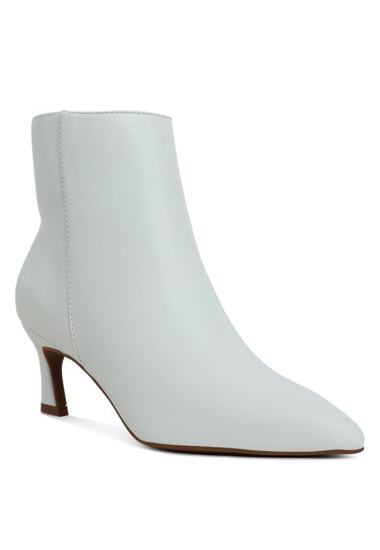 White faux leather ankle boots with block heel and pointed toe