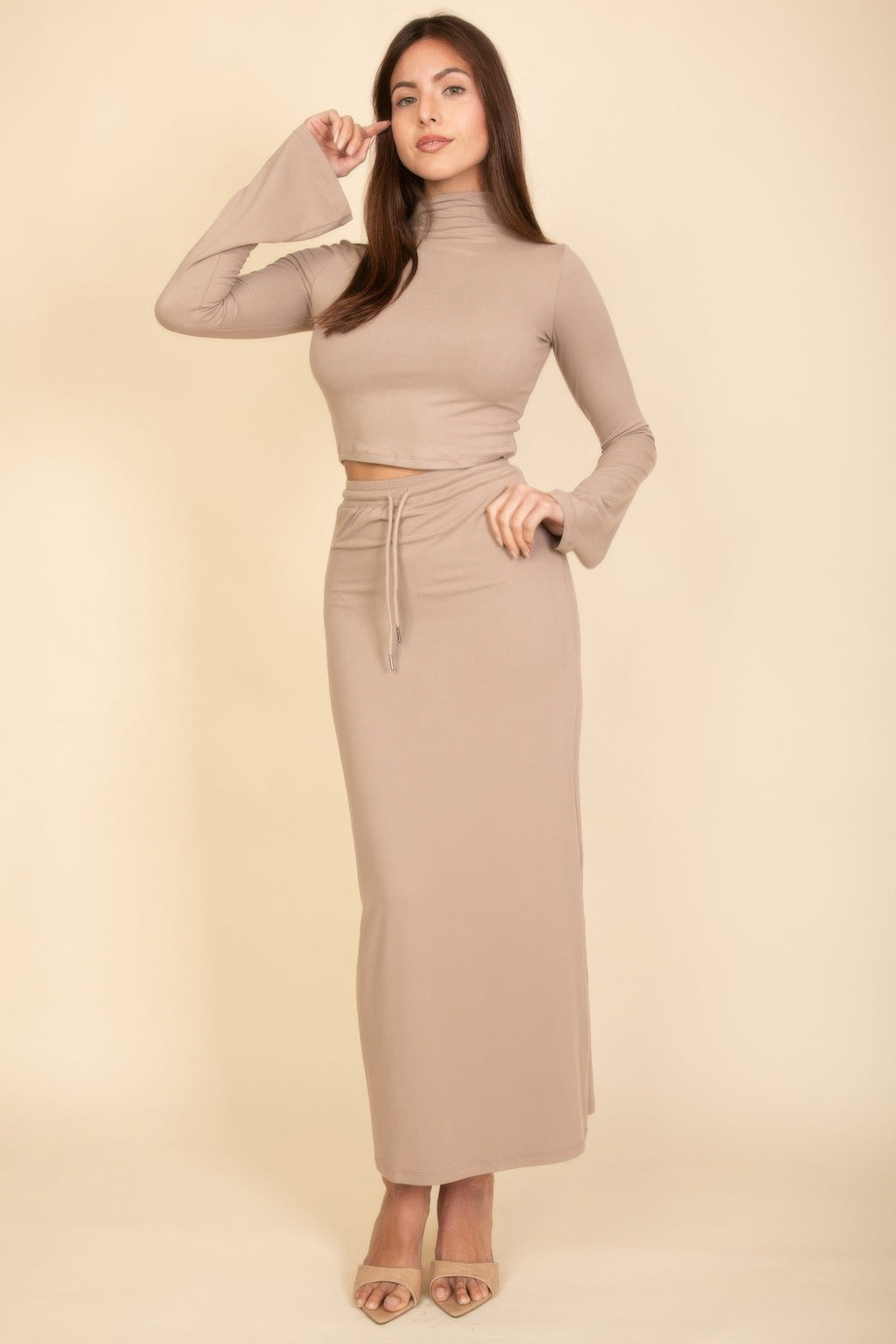 Taupe mock-neck crop top with high-waist maxi skirt, drawstring at center