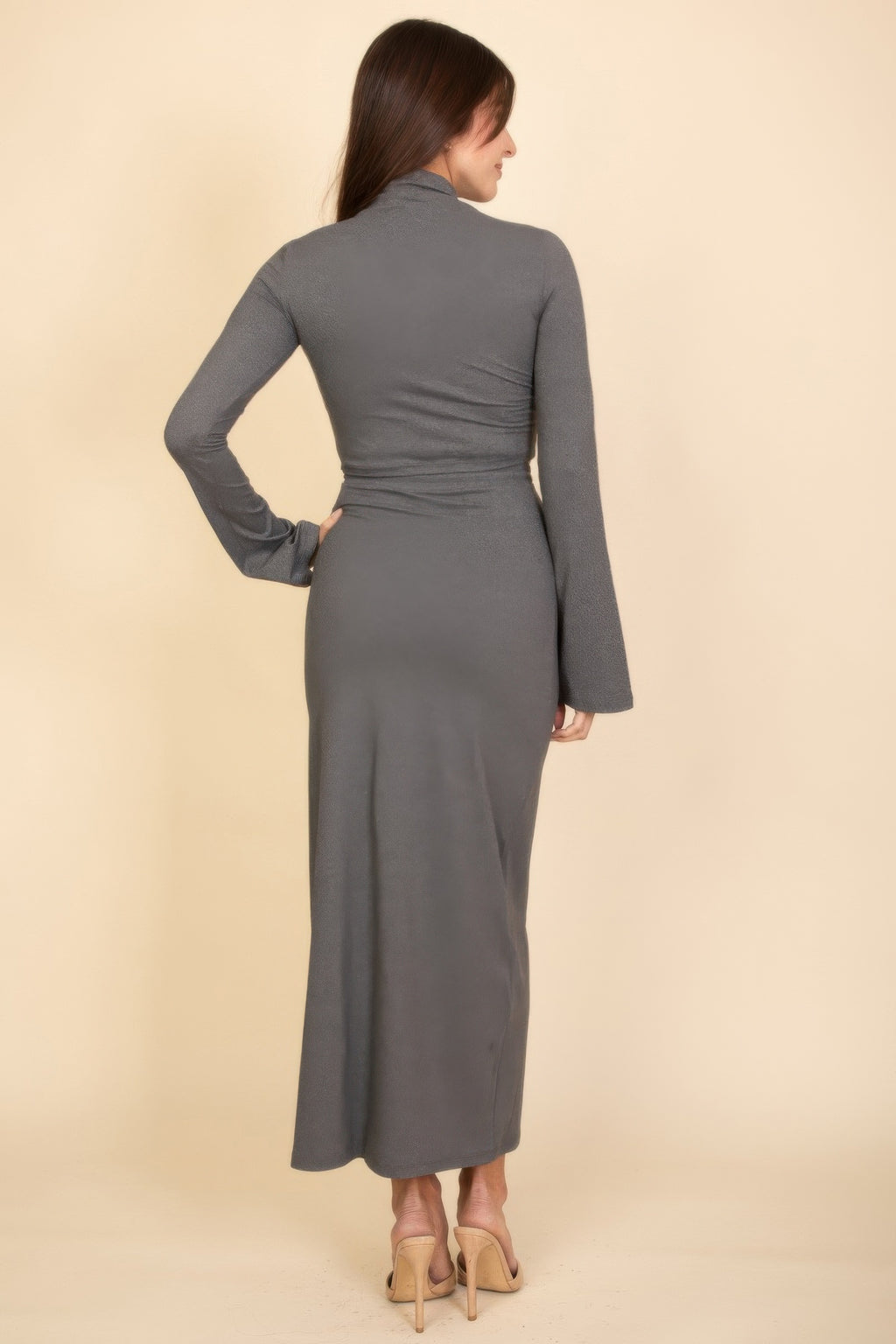 Back view: heather grey mock-neck crop top and maxi skirt with long bell sleeves