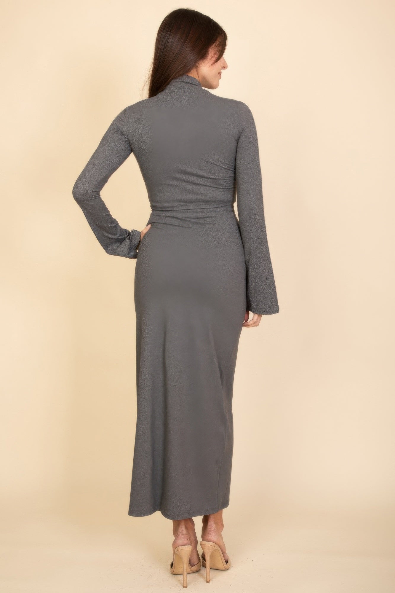 Back view: heather grey mock-neck crop top and maxi skirt with long bell sleeves