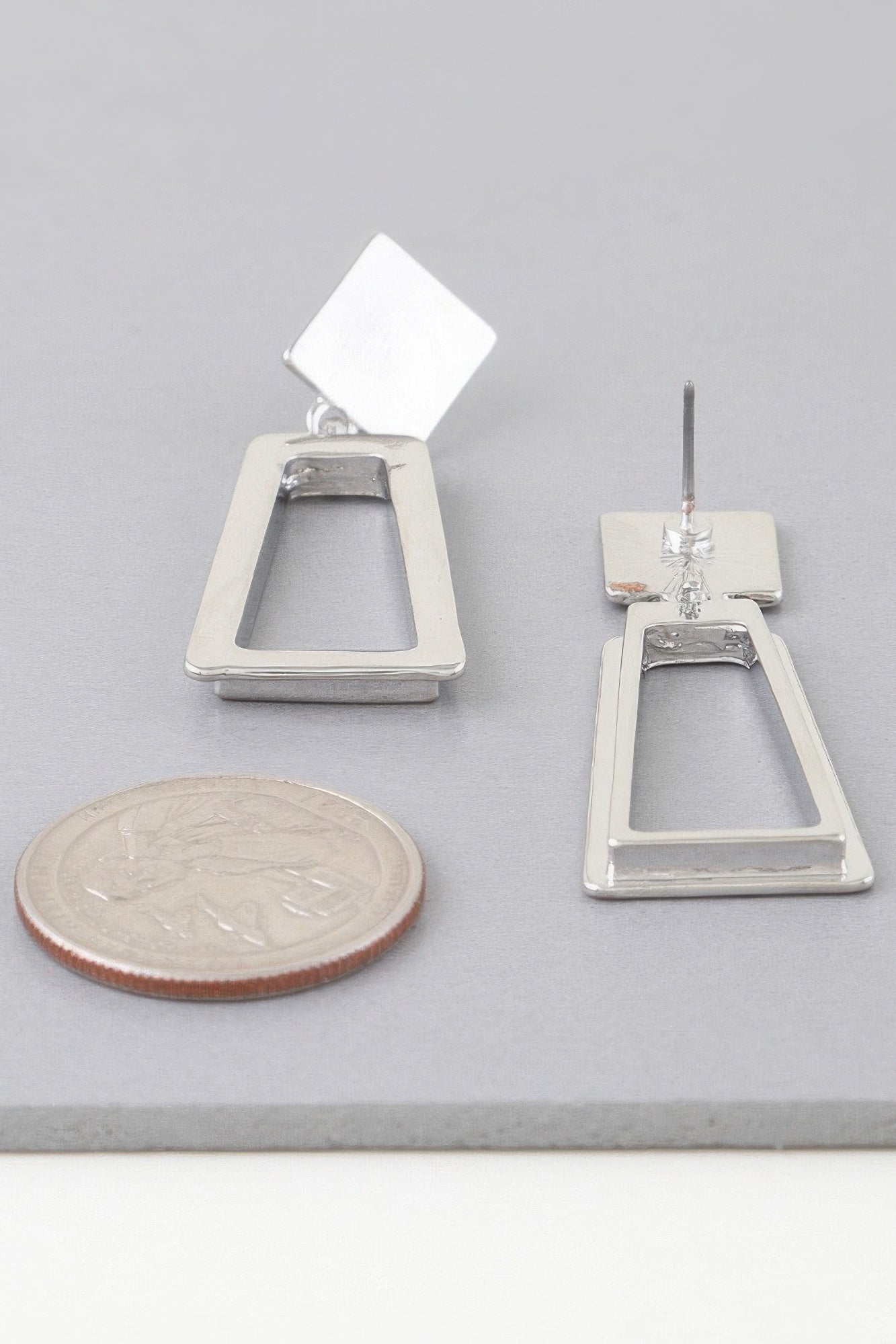 Silver-tone geometric frame drop earrings, square tops with outlined open drop frames