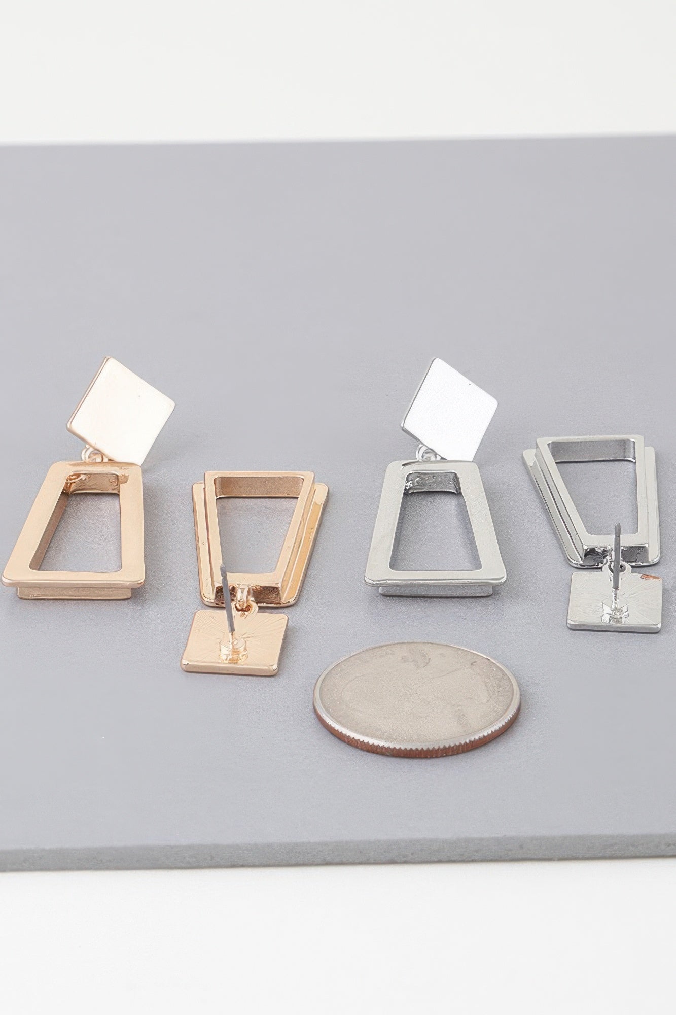 Geometric frame drop earrings in Gold- and Silver-tone metal, square and open frames