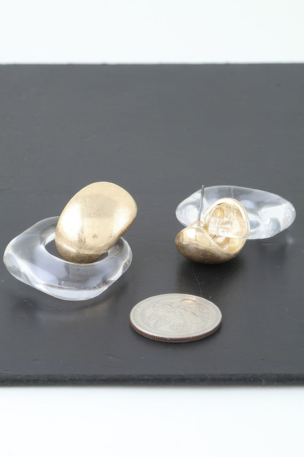 Gold drop earrings, oval gold tops in clear open acrylic frames