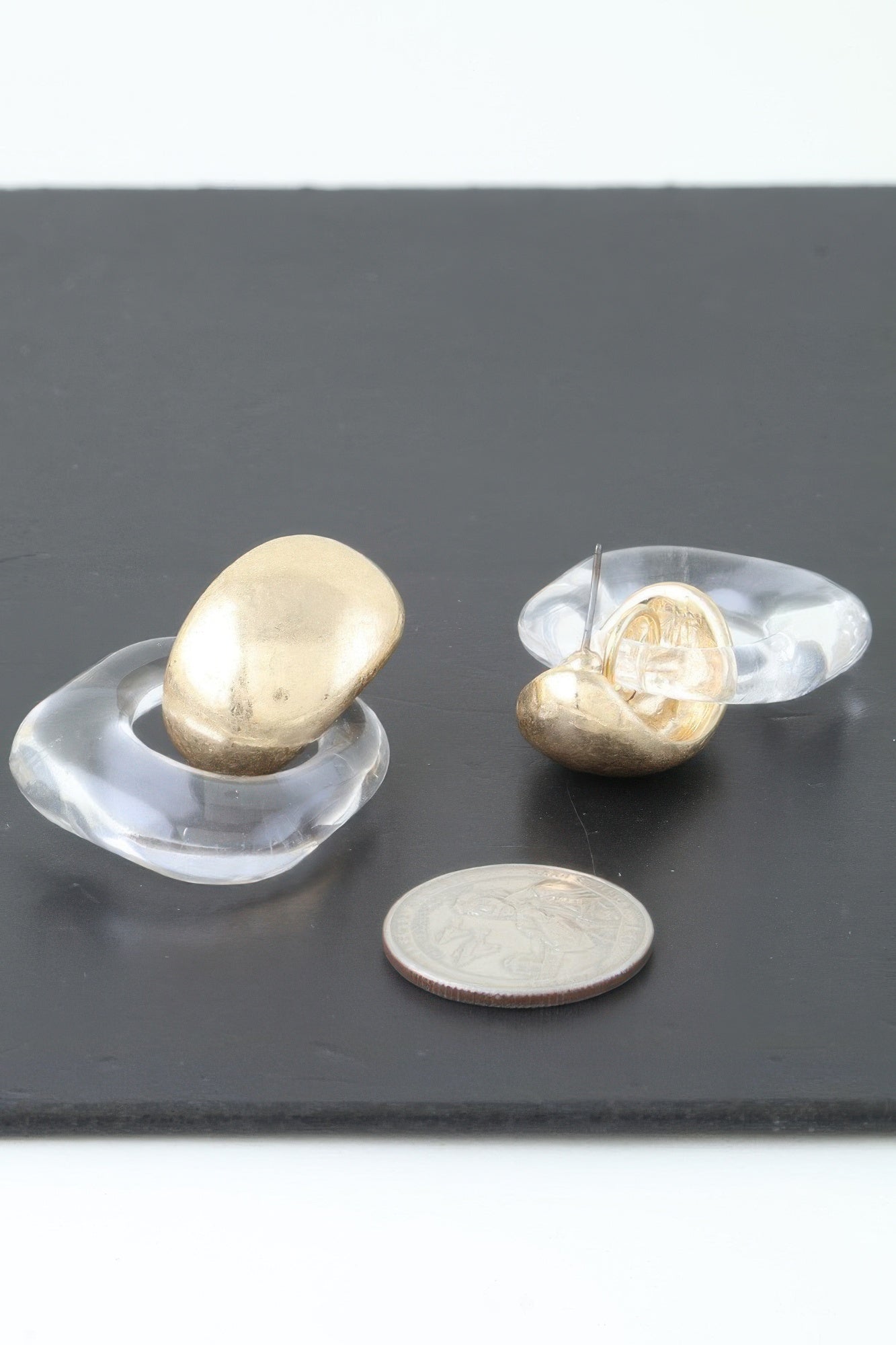 Gold drop earrings, oval gold tops in clear open acrylic frames