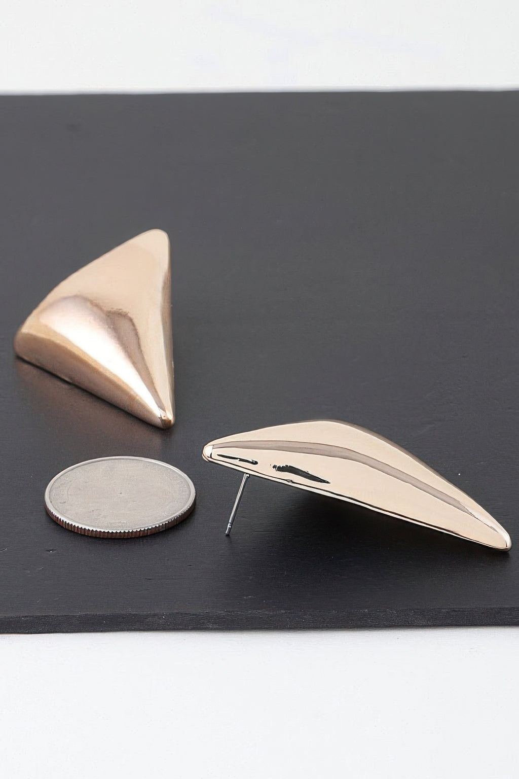 Triangular stud earrings, gold-tone, side view of smooth back and front