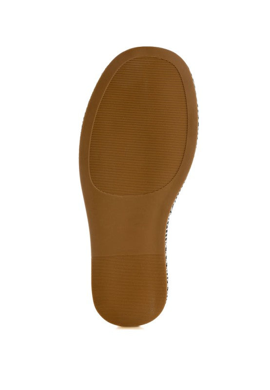 Außensohle der Raffia Flatform Slip Ons in Braun mit geripptem Profil