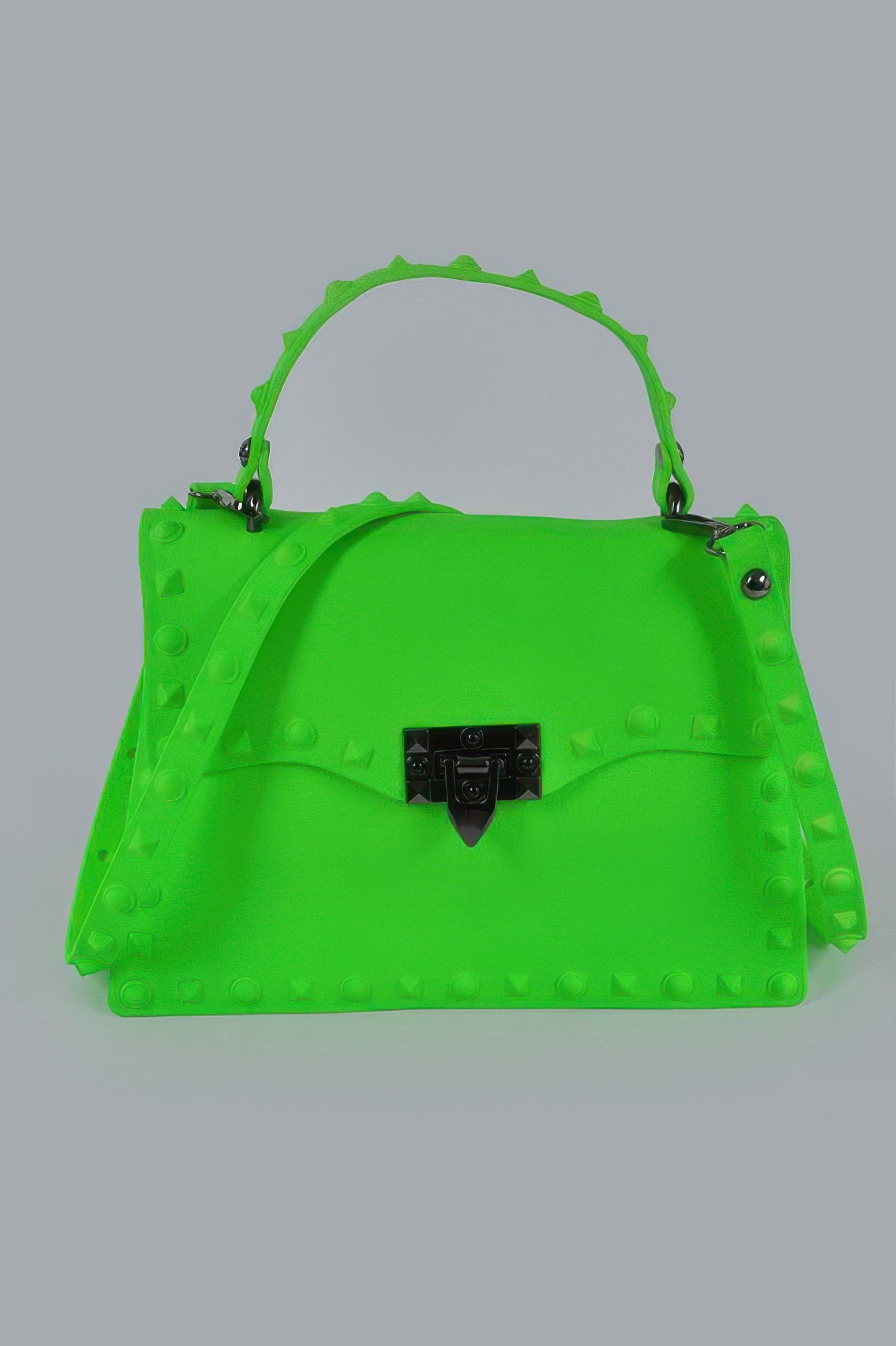 Monotone studded clutch in neon green with black gem-lock clasp and studded handles