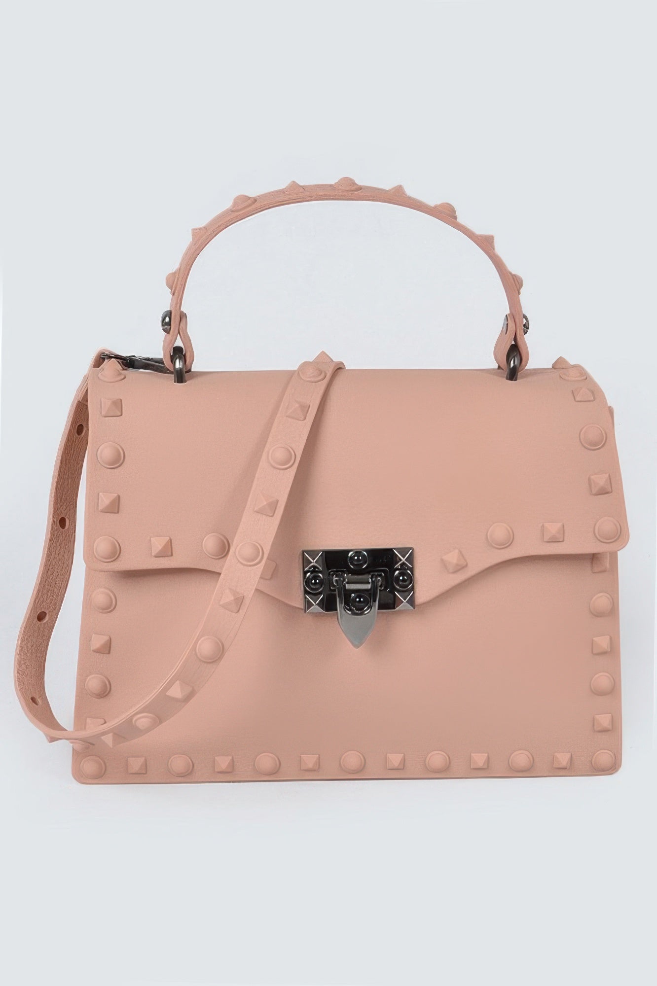 Monotone studded clutch in dusty rose with black gem-lock clasp and side crossbody strap