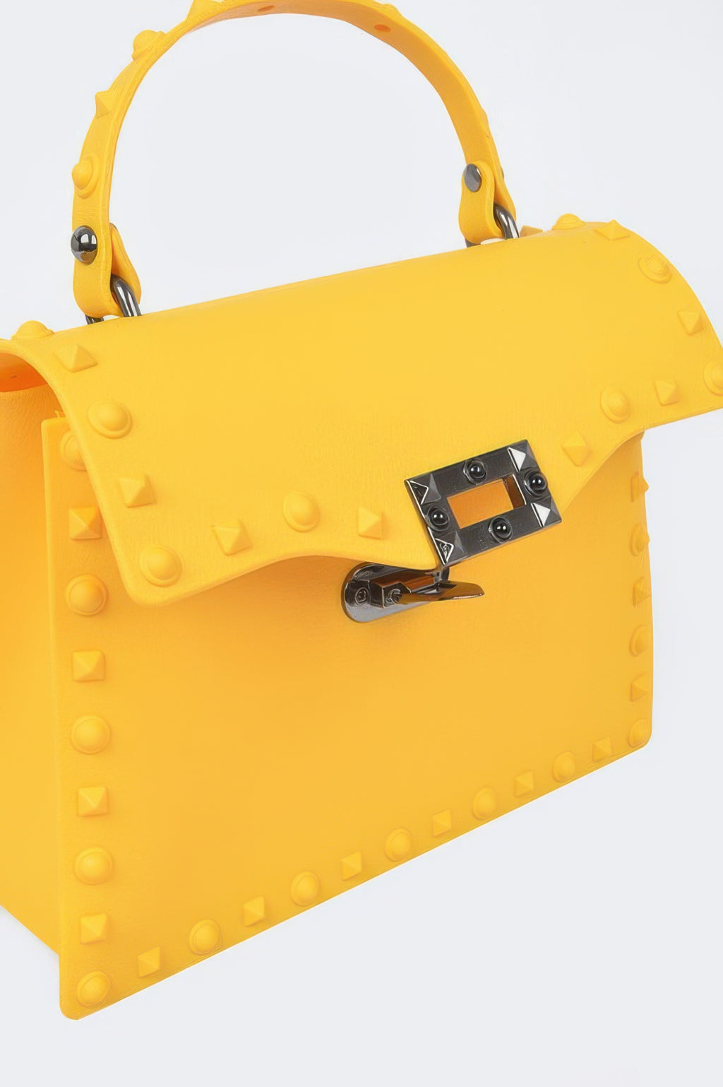 Yellow studded clutch with adjustable shoulder strap and rectangular front lock