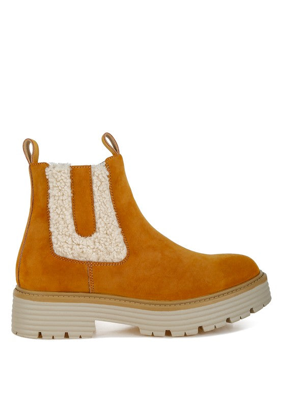 Front view tan suede ankle boots with cream faux fur insert and stacked platform sole