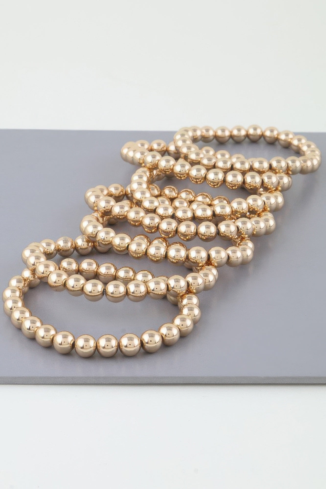 Multi beaded cuff bracelet, gold tone bead rows with clasp end view