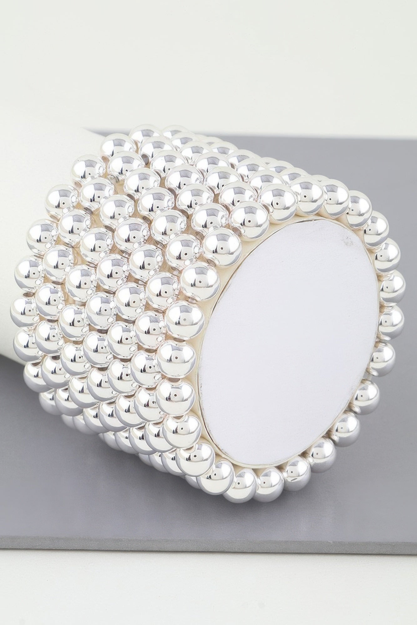 Multi Beaded Cuff Bracelet in silver tone, oval backing plate visible