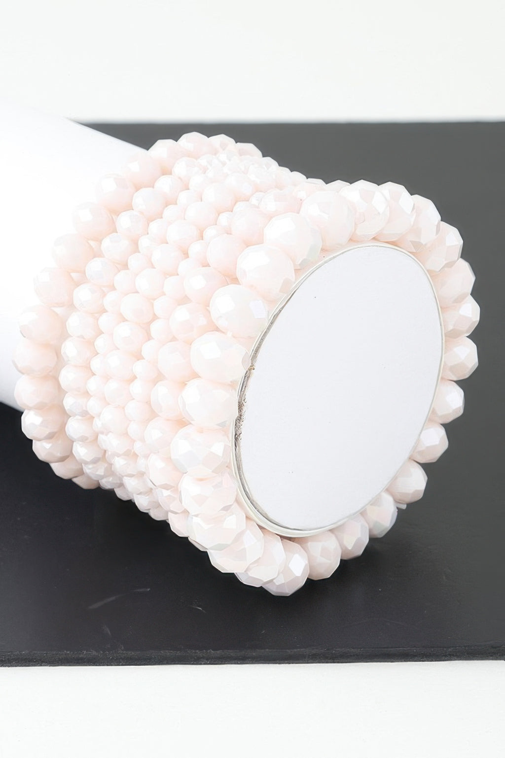 Multi crystal beaded bracelet in pale pink/white with oval clasp detail