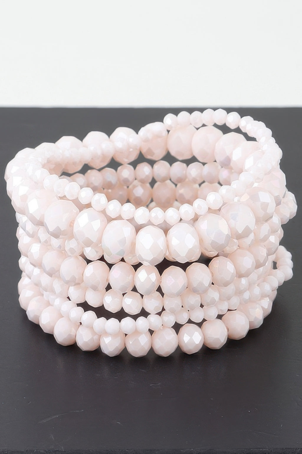 Multi crystal beaded bracelet with layered light pink beads