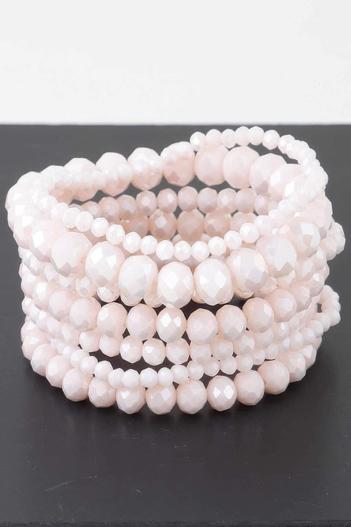 Multi crystal beaded bracelet with layered light pink beads