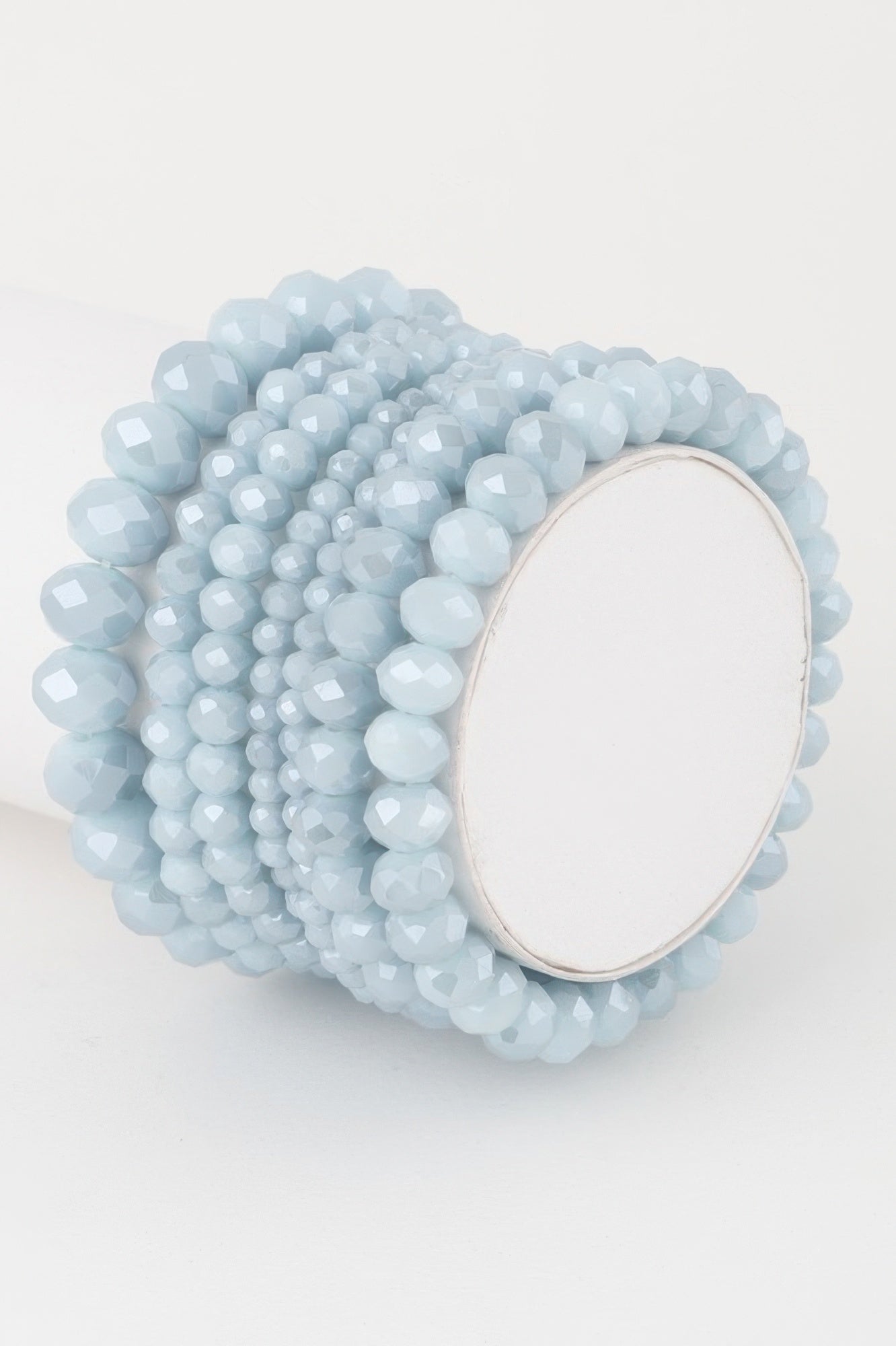 Multi crystal beaded bracelet in light blue with oval clasp detail