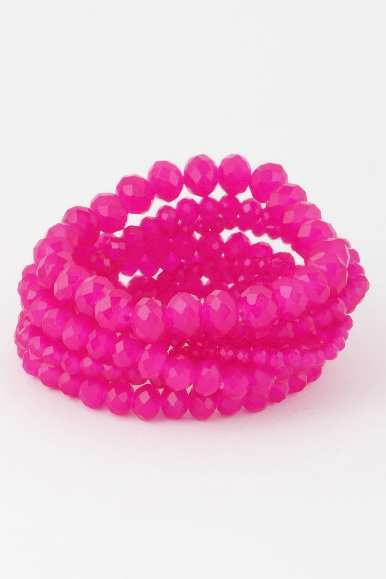 Multi crystal beaded bracelet in fuchsia with faceted bead texture