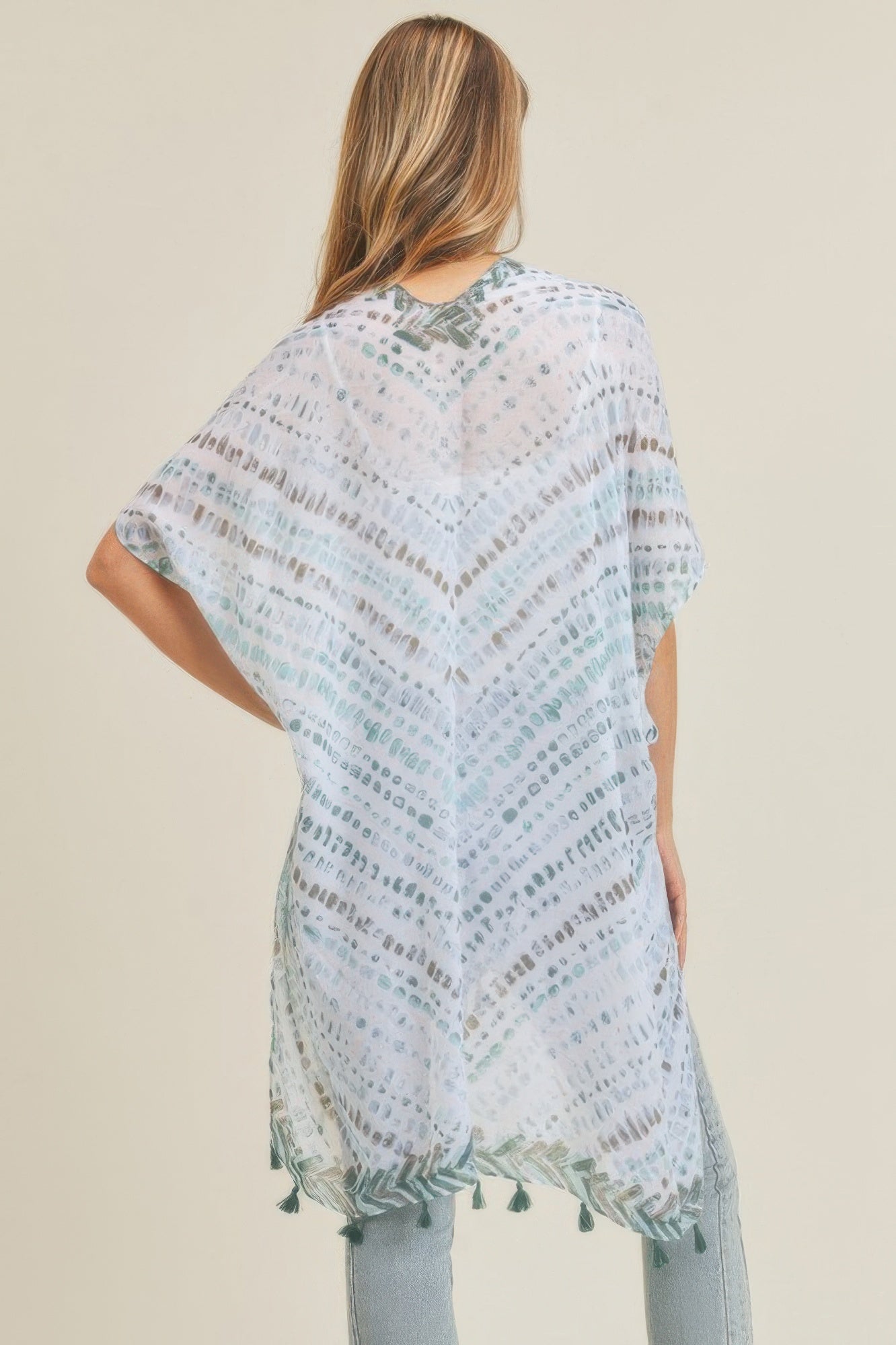 Multi dash pattern tassel kimono, back view, white with teal pattern and green tassel hem