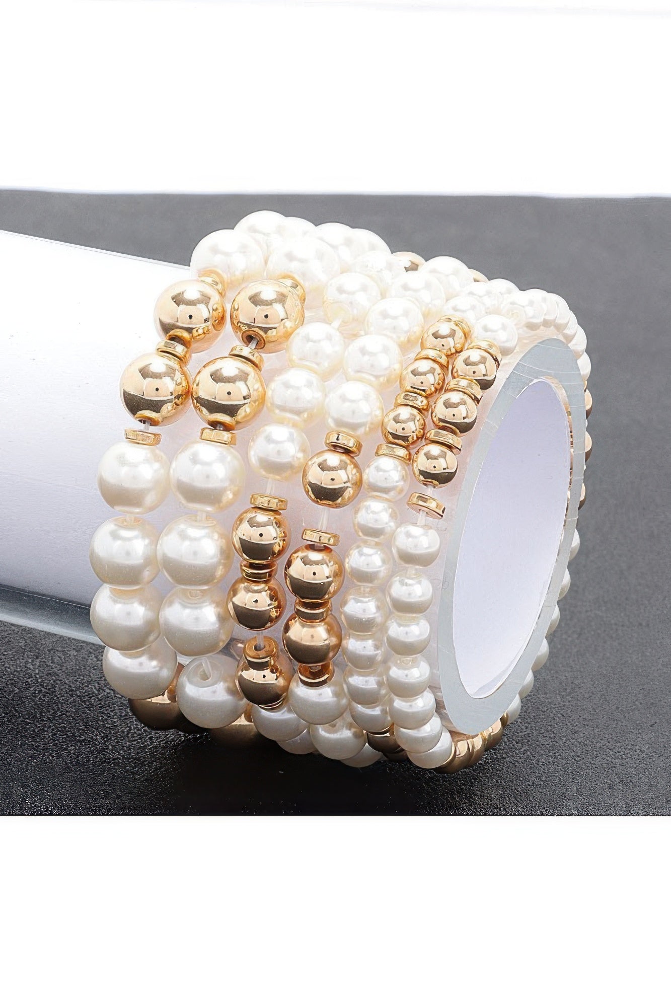 Multi faux stretch bracelet with white pearl beads and gold-tone spacers