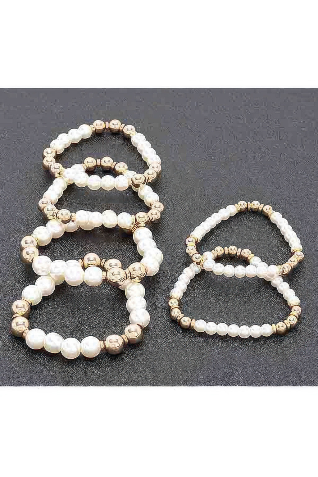 Set of multi faux stretch bracelets: white pearl beads with gold-tone accents