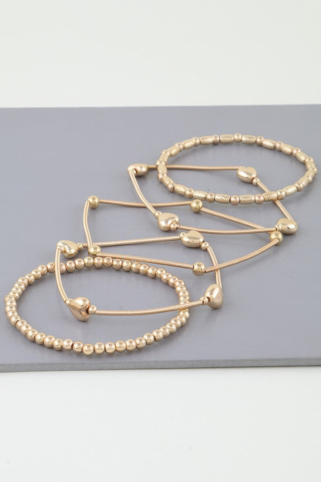 Multi Heart Coil Beaded Bracelet set (Gold) with heart-shaped beads on metal bands