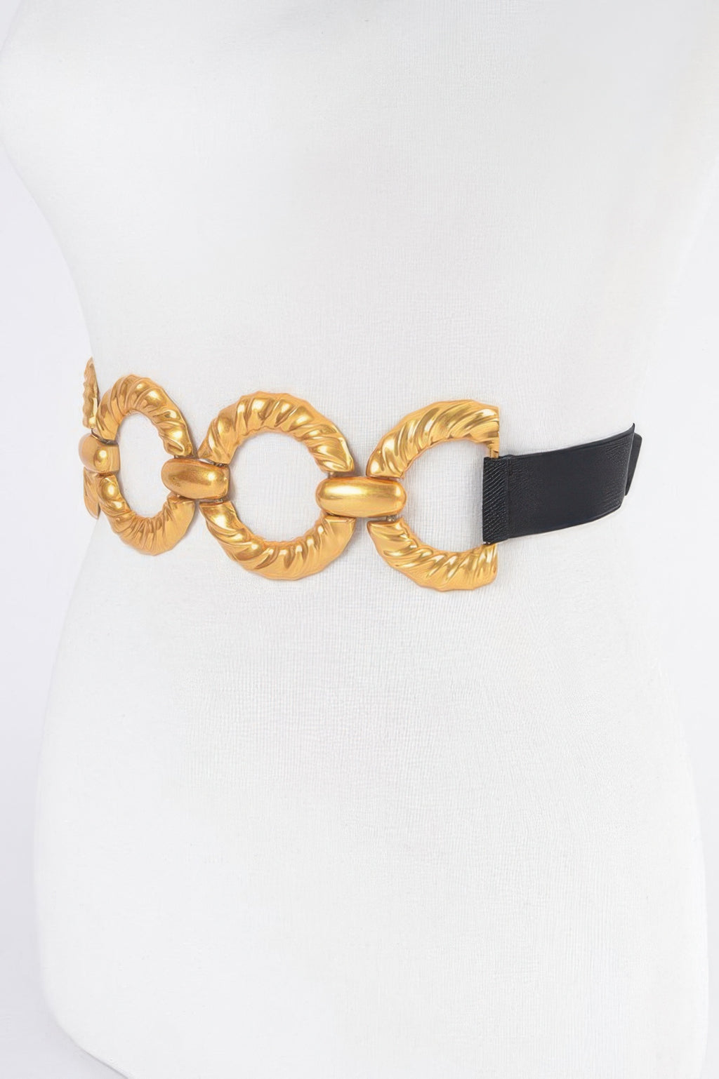 Elastic belt detail: black strap with gold oval ring buckle, plus size